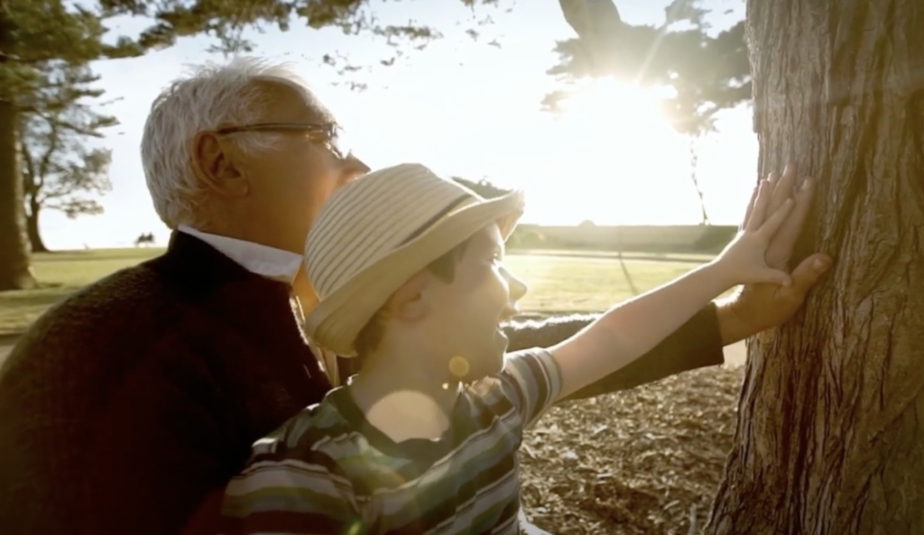 grandpa-and-grandchild-chosing-tree-whilst-pre-planning-funeral