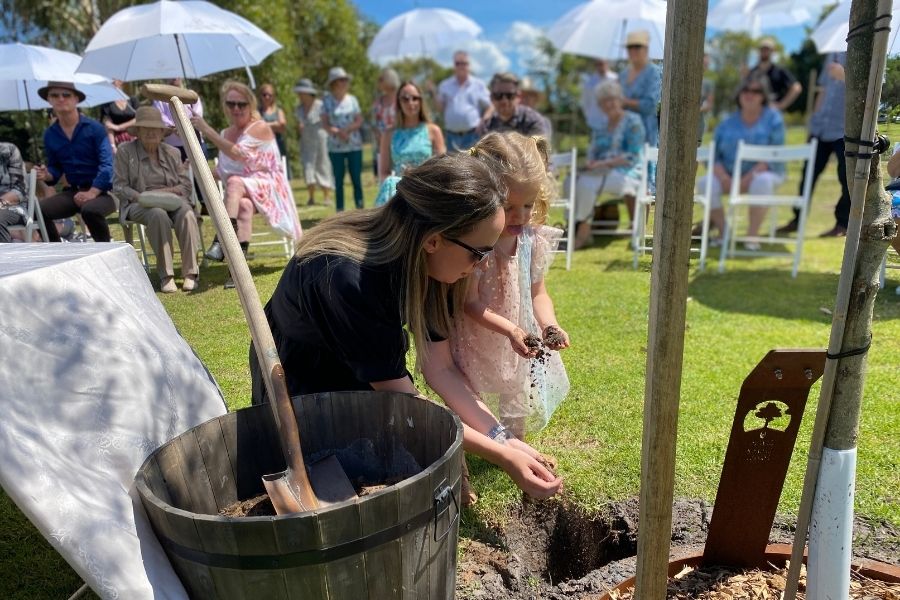 A family planting a Living Legacy Tree as an affordable funeral in Melbourne Australia