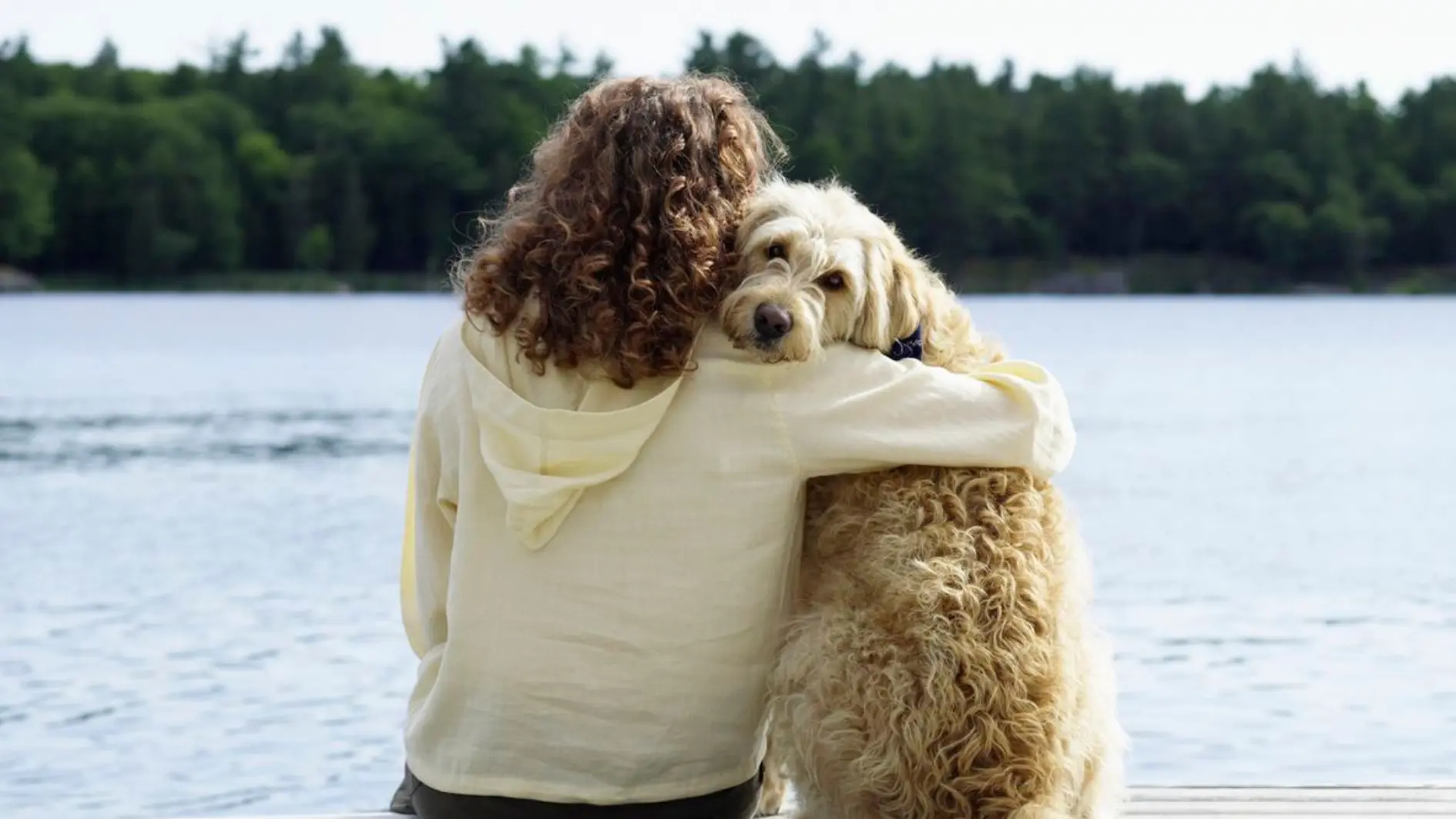 the lady hug her pet