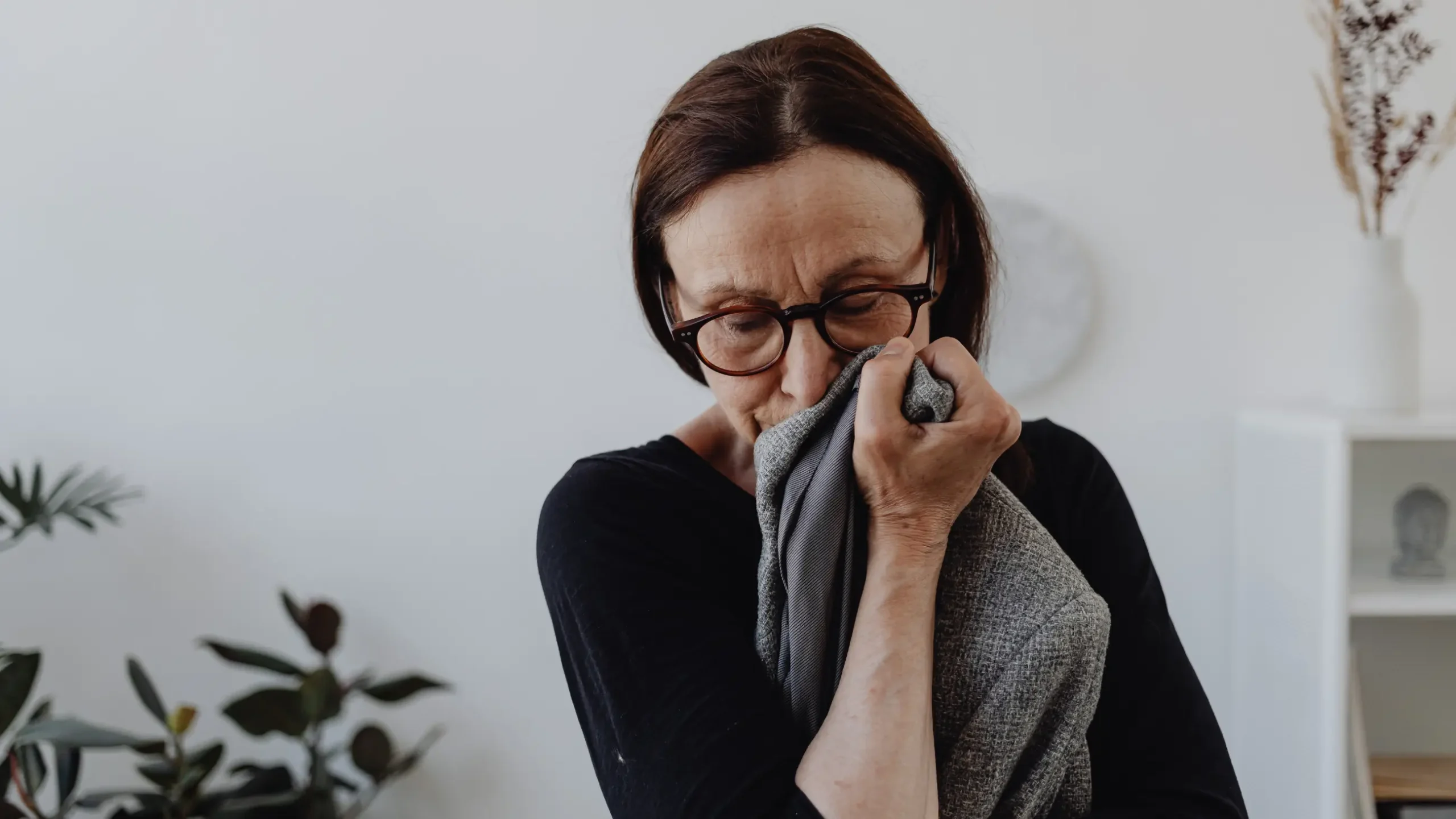 The old woman kissed the cloth that held memories of her loved one.