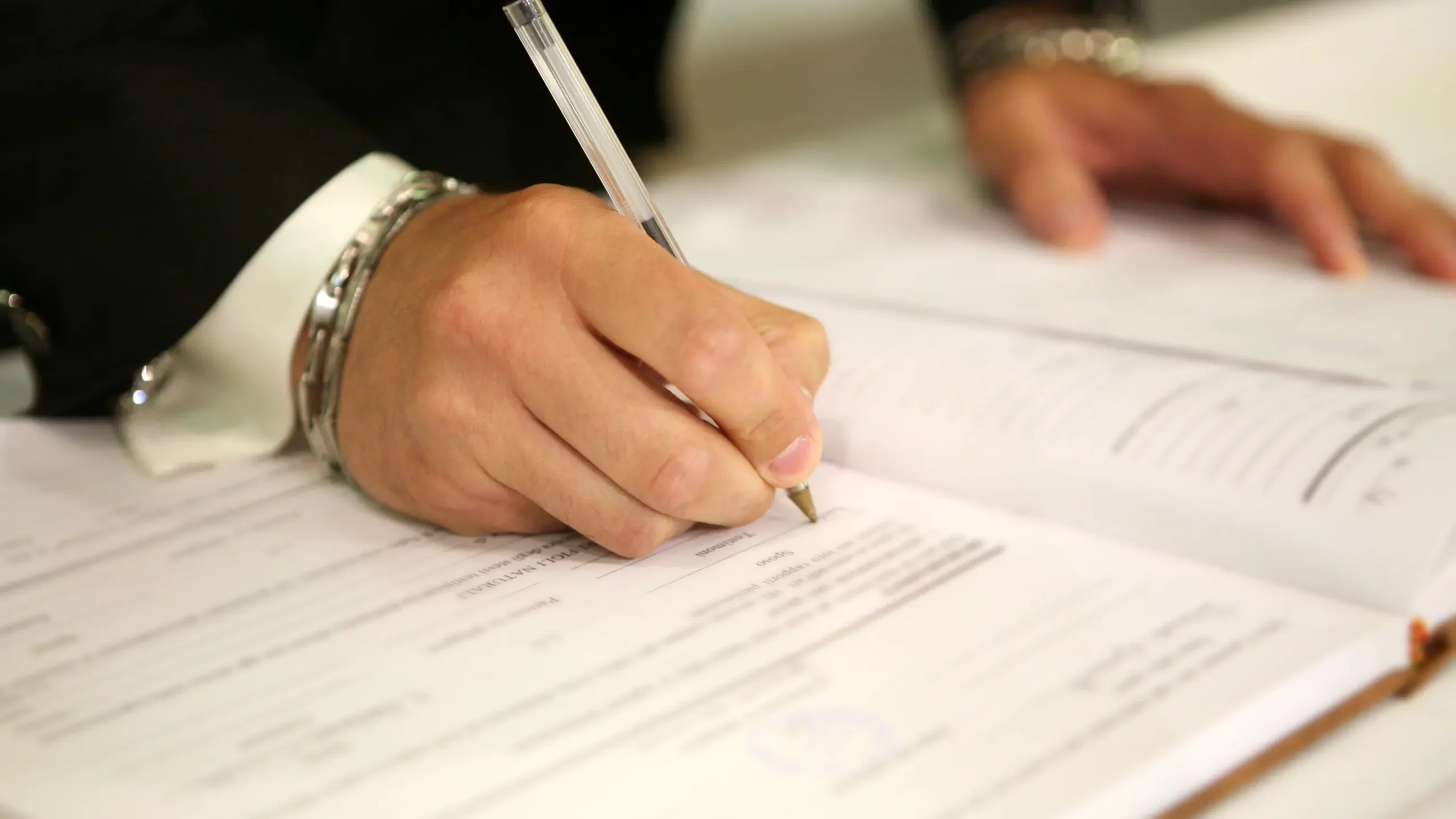 The man is filling out the registration form Death certificate Victoria/NSW/Queensland